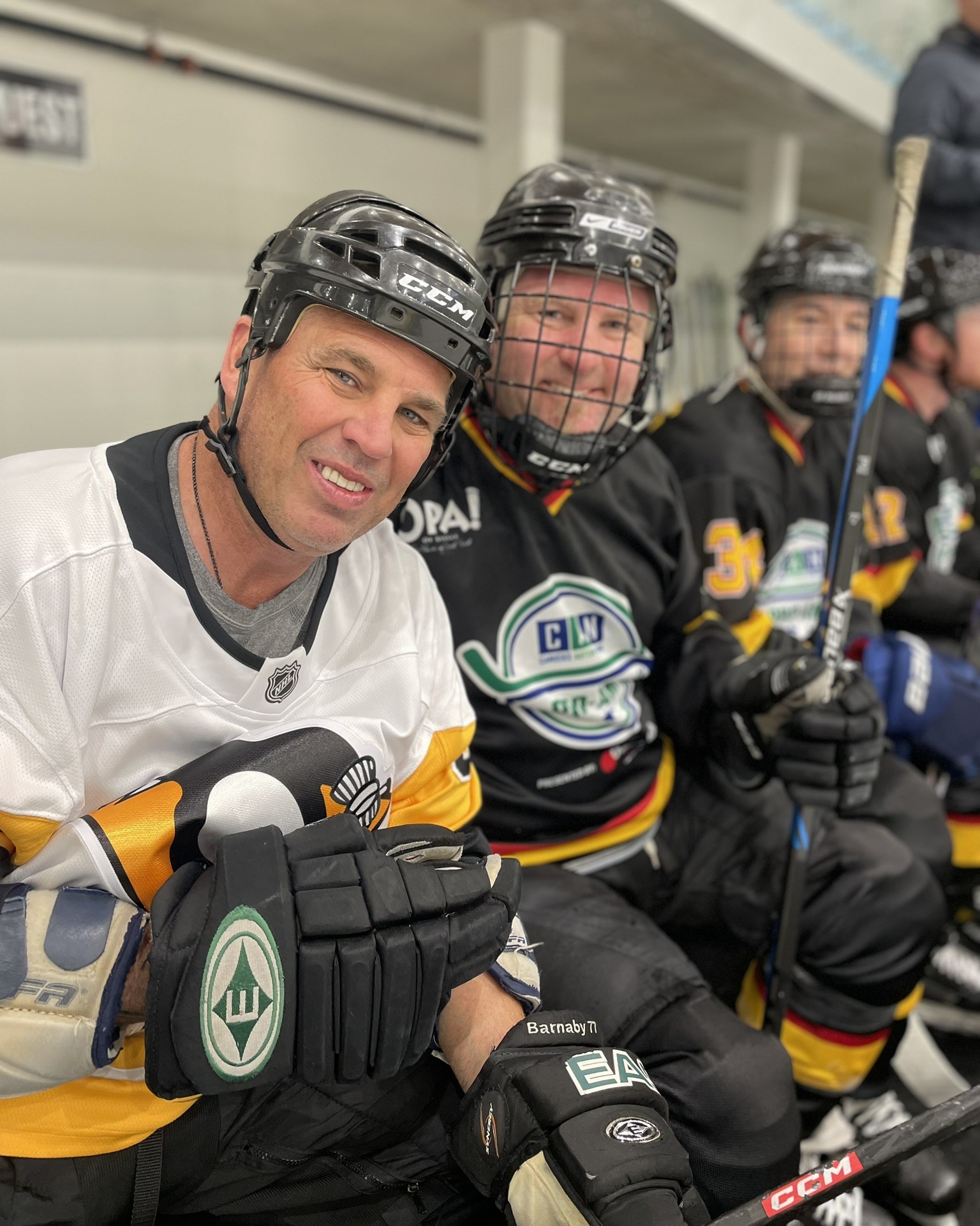 NHL Alumni Matthew Barnaby with a teammate on the bench at the 2023 CAN Pro-Am
