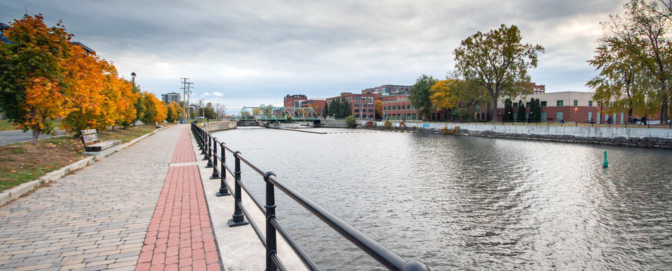 A canal runs along side a brick pathway with. A canal runs along side a brick pathway with.