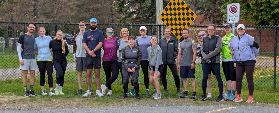 Runners pose after a race. Runners pose after a race.