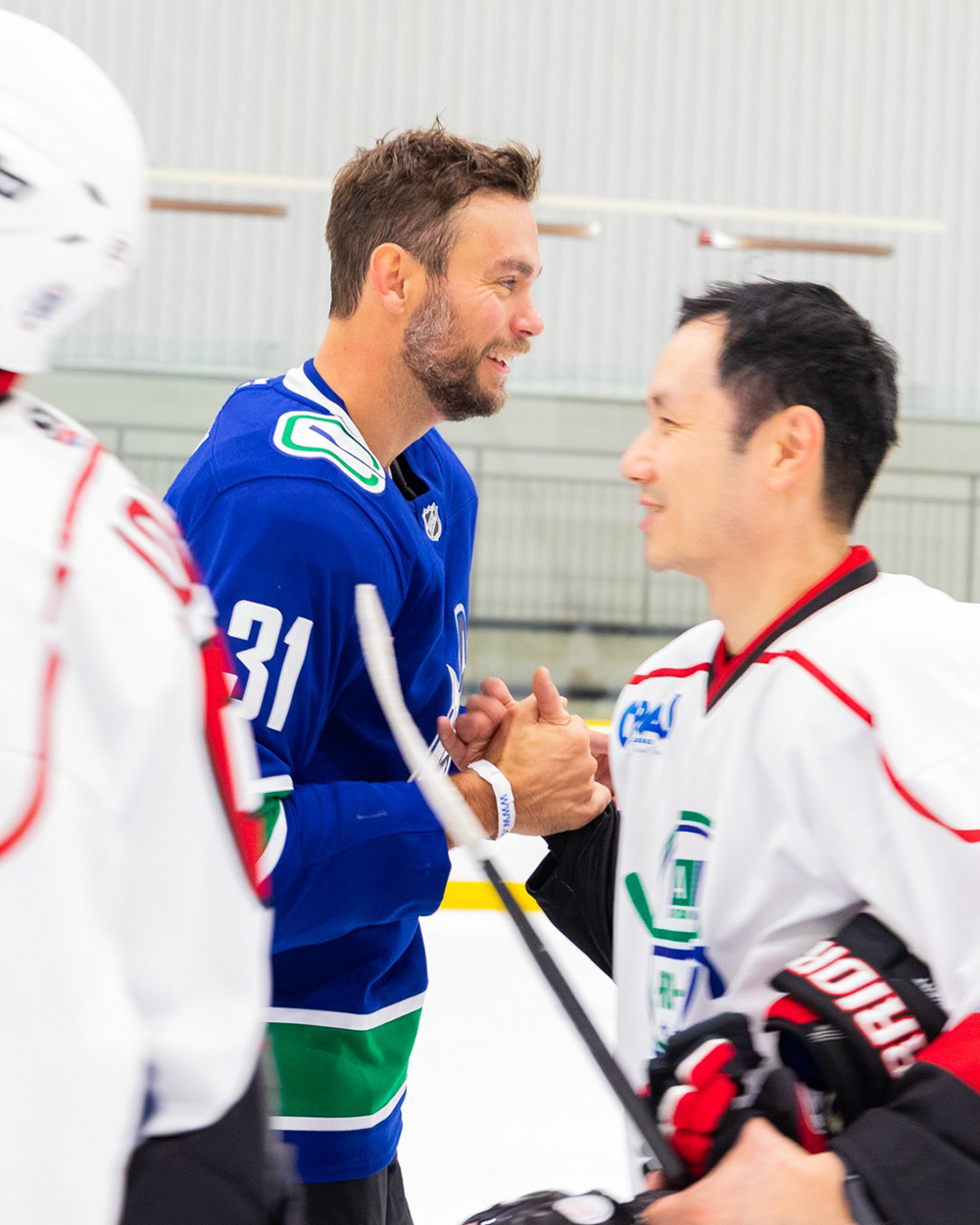 NHL Alumni shaking hands with an opponent at the 2024 CAN Pro-Am